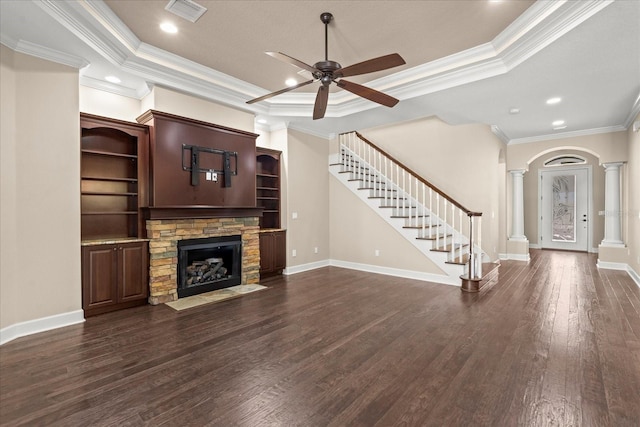 unfurnished living room featuring ornate columns, ornamental molding, visible vents, and a fireplace