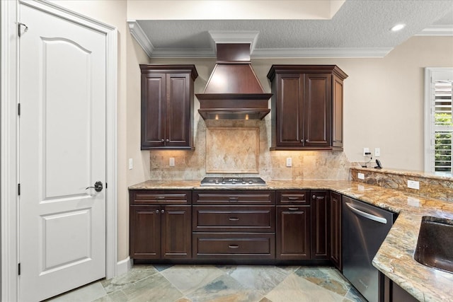 kitchen featuring stainless steel appliances, light stone counters, custom range hood, and dark brown cabinets