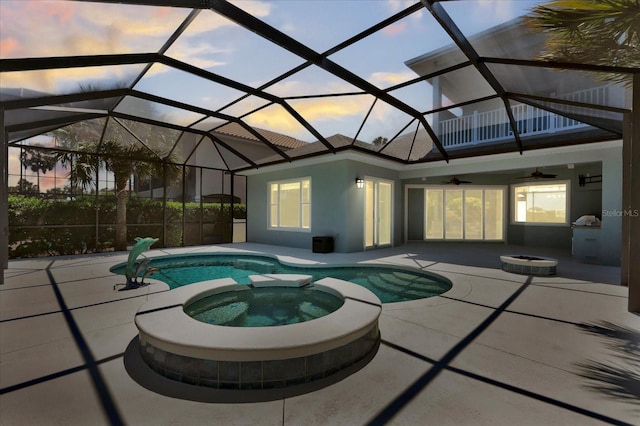 view of pool with a pool with connected hot tub, a ceiling fan, and a patio area