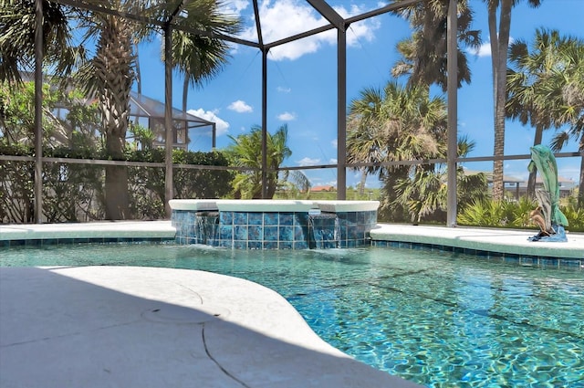 pool featuring a lanai and a hot tub
