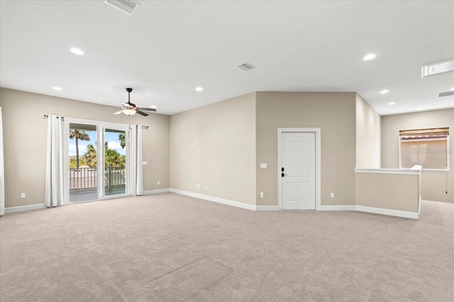 spare room with ceiling fan, light carpet, recessed lighting, and visible vents
