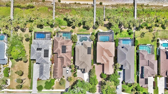 birds eye view of property with a residential view
