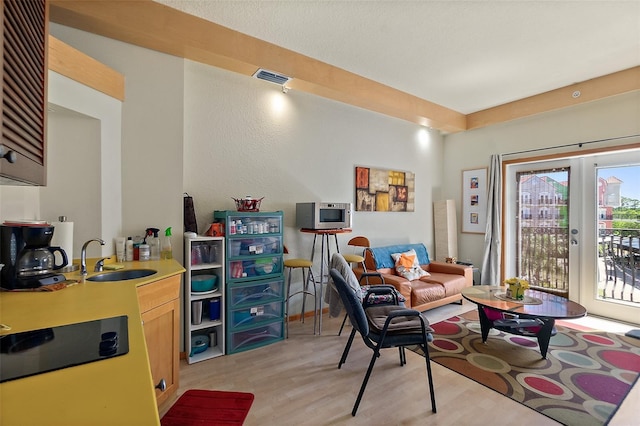 101 Palm Harbor Pkwy Unit A303, Palm Coast, FL 32137 - living room featuring light wood finished floors