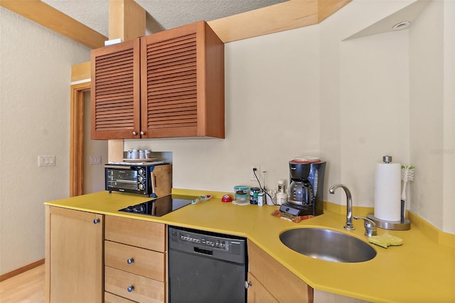 101 Palm Harbor Pkwy Unit A303, Palm Coast, FL 32137 - kitchen featuring dishwashing machine, a sink, light countertops, and light brown cabinetry