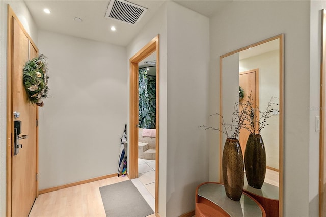 101 Palm Harbor Pkwy Unit A303, Palm Coast, FL 32137 - hallway featuring light wood-style floors, recessed lighting, and baseboards