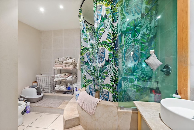 101 Palm Harbor Pkwy Unit A303, Palm Coast, FL 32137 - bathroom with tile patterned floors, a shower, vanity, and tile walls