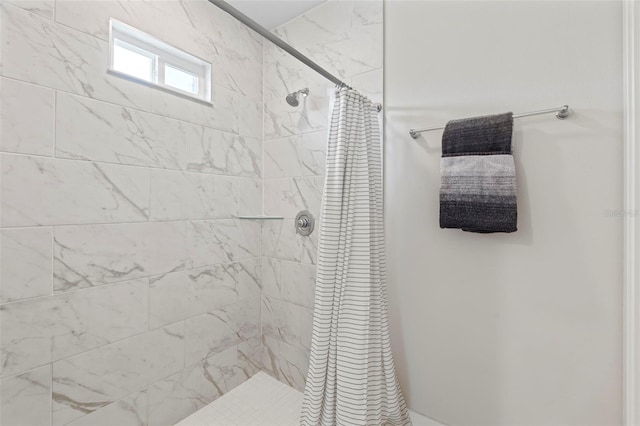 bathroom with a shower stall