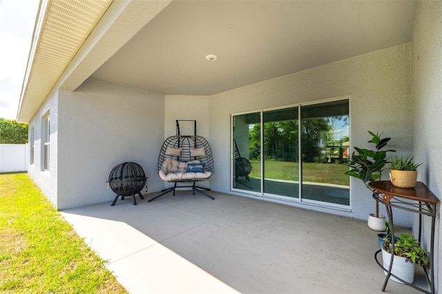 view of patio with an outdoor fire pit
