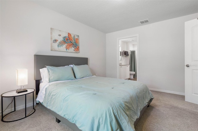 bedroom featuring baseboards, carpet flooring, connected bathroom, and visible vents