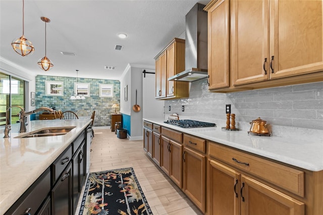 106 Key Grass Ct, Saint Johns, FL 32259 - kitchen featuring wall chimney range hood, a sink, light countertops, baseboards, and stainless steel gas stovetop