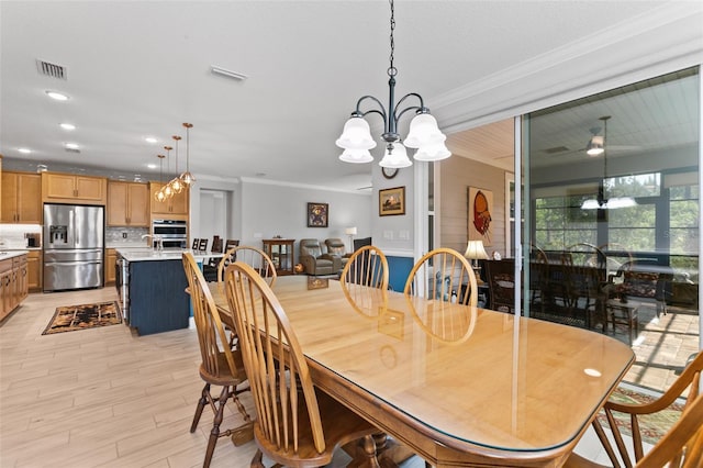106 Key Grass Ct, Saint Johns, FL 32259 - dining area with crown molding, visible vents, and light wood finished floors