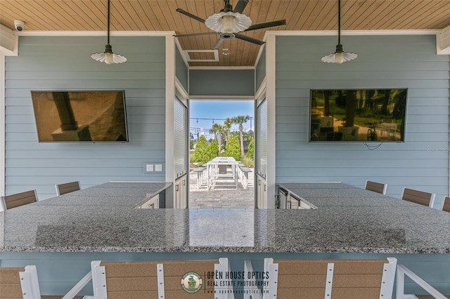 106 Key Grass Ct, Saint Johns, FL 32259 - kitchen featuring wooden walls, wood ceiling, stone counters, and a ceiling fan