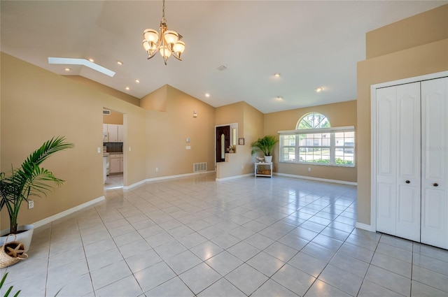 unfurnished living room featuring an inviting chandelier, recessed lighting, baseboards, light tile patterned floors, and visible vents