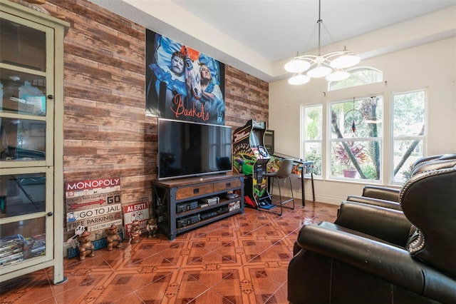 114 Emerald Lake Dr, Palm Coast, FL 32137 - tiled living room with a chandelier and wood walls