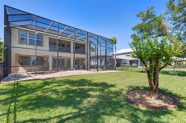 114 Emerald Lake Dr, Palm Coast, FL 32137 - rear view of property featuring stucco siding, a lanai, fence, and a yard