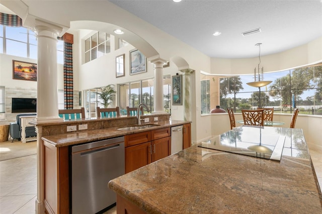 114 Emerald Lake Dr, Palm Coast, FL 32137 - kitchen featuring stainless steel dishwasher, decorative columns, and a sink