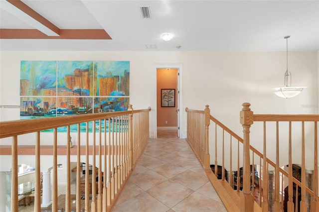 114 Emerald Lake Dr, Palm Coast, FL 32137 - hallway with baseboards, visible vents, tile patterned flooring, and an upstairs landing