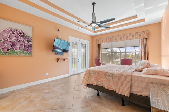 114 Emerald Lake Dr, Palm Coast, FL 32137 - bedroom featuring tile patterned flooring, baseboards, access to outside, a raised ceiling, and a ceiling fan