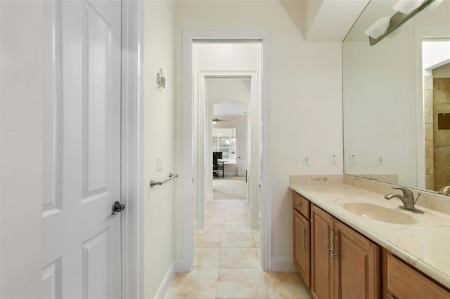 114 Emerald Lake Dr, Palm Coast, FL 32137 - bathroom with tile patterned floors, ceiling fan, baseboards, and vanity