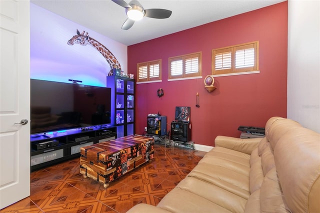 114 Emerald Lake Dr, Palm Coast, FL 32137 - living room featuring ceiling fan and a wood stove