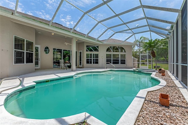 69 Coquina Ridge Way, Ormond Beach, FL 32174 - view of swimming pool with glass enclosure, ceiling fan, a pool with connected hot tub, and a patio area