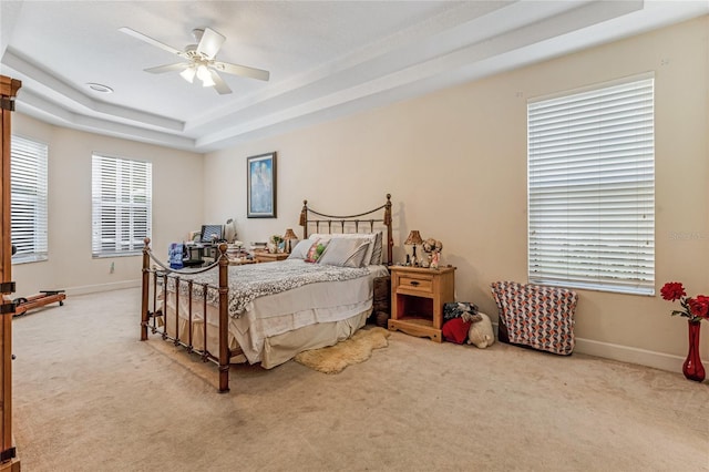 69 Coquina Ridge Way, Ormond Beach, FL 32174 - carpeted bedroom featuring a ceiling fan, baseboards, and a raised ceiling