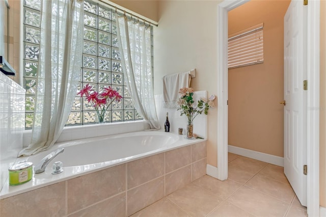69 Coquina Ridge Way, Ormond Beach, FL 32174 - full bathroom with tile patterned floors, baseboards, and a garden tub