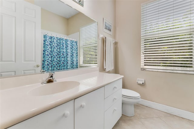 69 Coquina Ridge Way, Ormond Beach, FL 32174 - full bath with tile patterned flooring, vanity, toilet, baseboards, and curtained shower