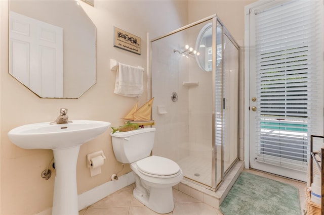 69 Coquina Ridge Way, Ormond Beach, FL 32174 - full bathroom with tile patterned flooring, toilet, and a shower stall