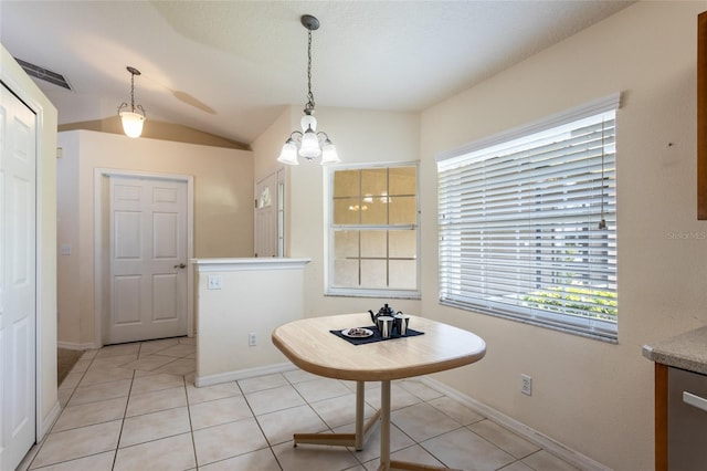 28 Weller Ln, Palm Coast, FL 32164 - dining room with light tile patterned floors, baseboards, vaulted ceiling, and a chandelier