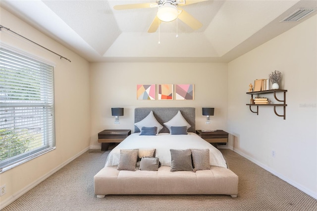 28 Weller Ln, Palm Coast, FL 32164 - carpeted bedroom with visible vents, a ceiling fan, a raised ceiling, and baseboards