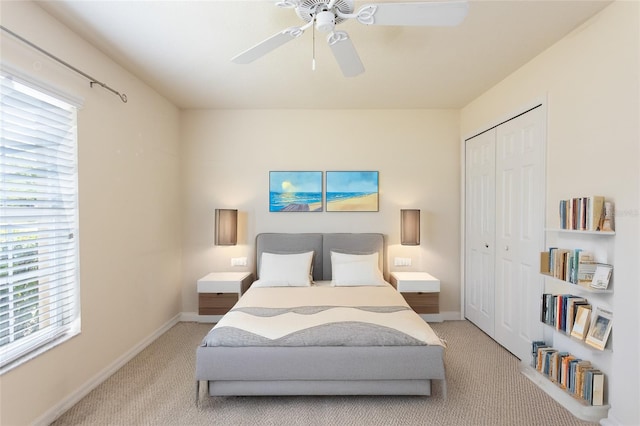 28 Weller Ln, Palm Coast, FL 32164 - carpeted bedroom featuring baseboards, multiple windows, ceiling fan, and a closet
