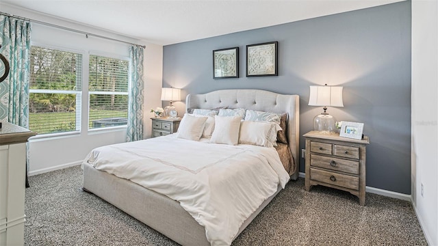 carpeted bedroom with baseboards