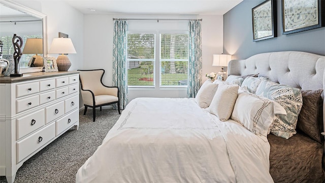 bedroom with dark colored carpet