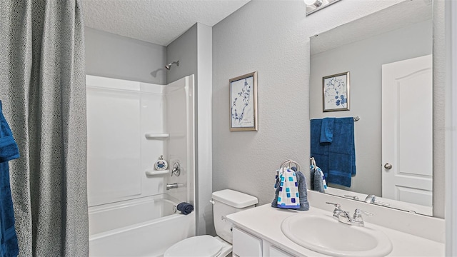 full bathroom with vanity, shower / bath combo with shower curtain, a textured wall, toilet, and a textured ceiling