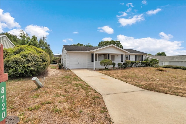 8720 SW 108th Ln, Ocala, FL 34481 - view of front of property with a garage, a front lawn, driveway, and covered porch