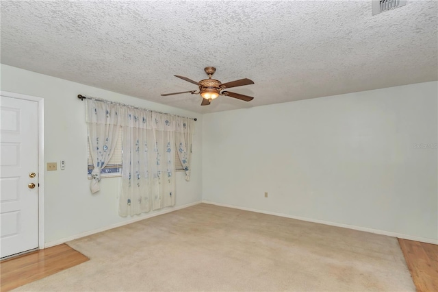 8720 SW 108th Ln, Ocala, FL 34481 - carpeted empty room with a ceiling fan, baseboards, visible vents, and a textured ceiling