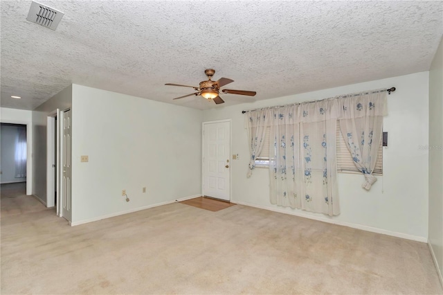 8720 SW 108th Ln, Ocala, FL 34481 - spare room featuring visible vents, carpet flooring, baseboards, and a ceiling fan