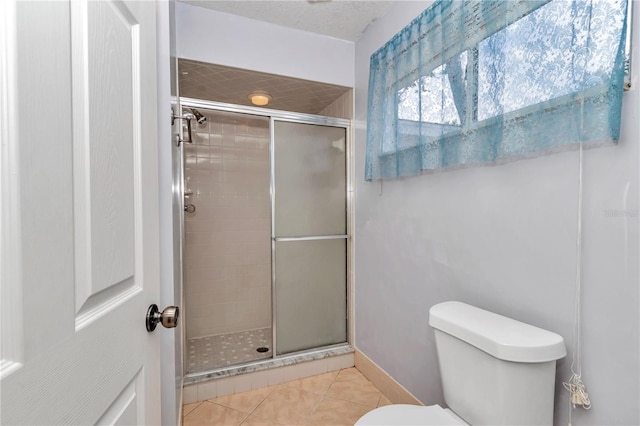 8720 SW 108th Ln, Ocala, FL 34481 - bathroom with baseboards, tile patterned floors, toilet, and a shower stall