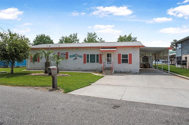 view of front facade featuring an attached carport, brick siding, concrete driveway, and a front lawn