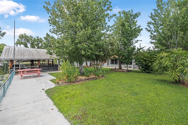 view of community featuring a lawn and a gazebo
