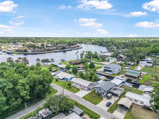 drone / aerial view with a water view and a residential view