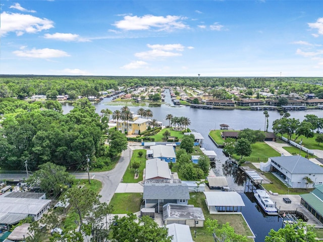 drone / aerial view featuring a water view and a residential view