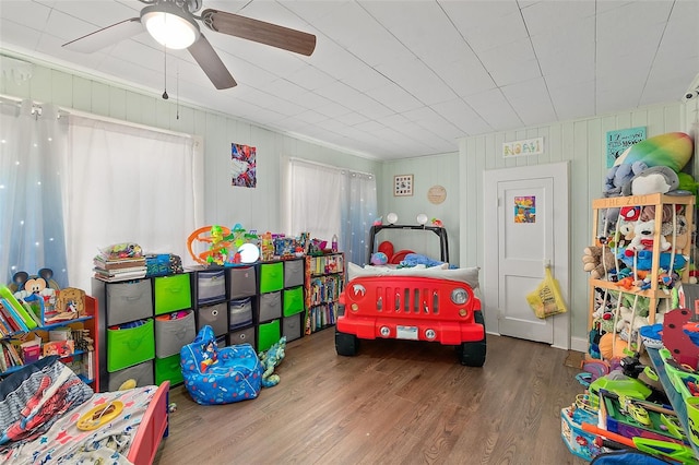 bedroom featuring ceiling fan and wood finished floors