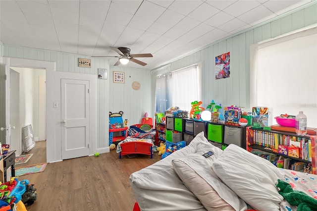 bedroom with ceiling fan and wood finished floors