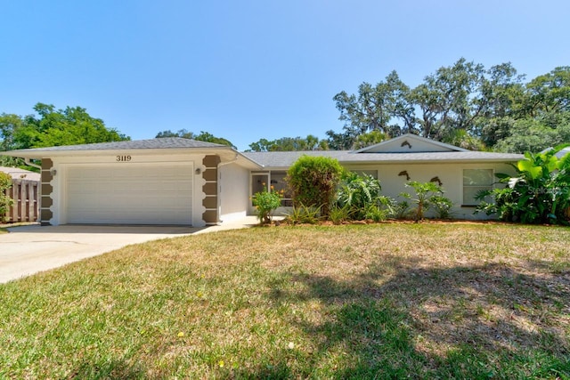 ranch-style house with a garage, a front lawn, fence, stucco siding, and driveway