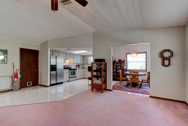 living area with baseboards, visible vents, light carpet, and ceiling fan with notable chandelier
