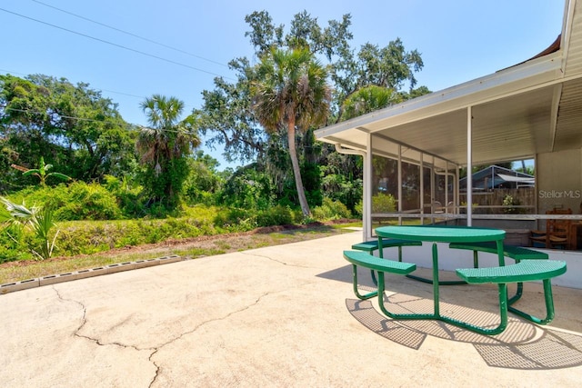 view of property's community with a patio area
