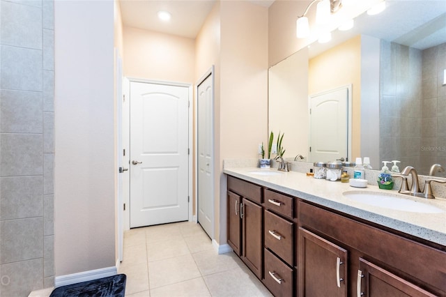 35 Park Place Cir, Palm Coast, FL 32164 - full bathroom featuring baseboards, double vanity, tile patterned floors, and a sink