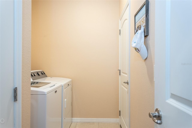 35 Park Place Cir, Palm Coast, FL 32164 - laundry room with laundry area, baseboards, independent washer and dryer, and light tile patterned flooring